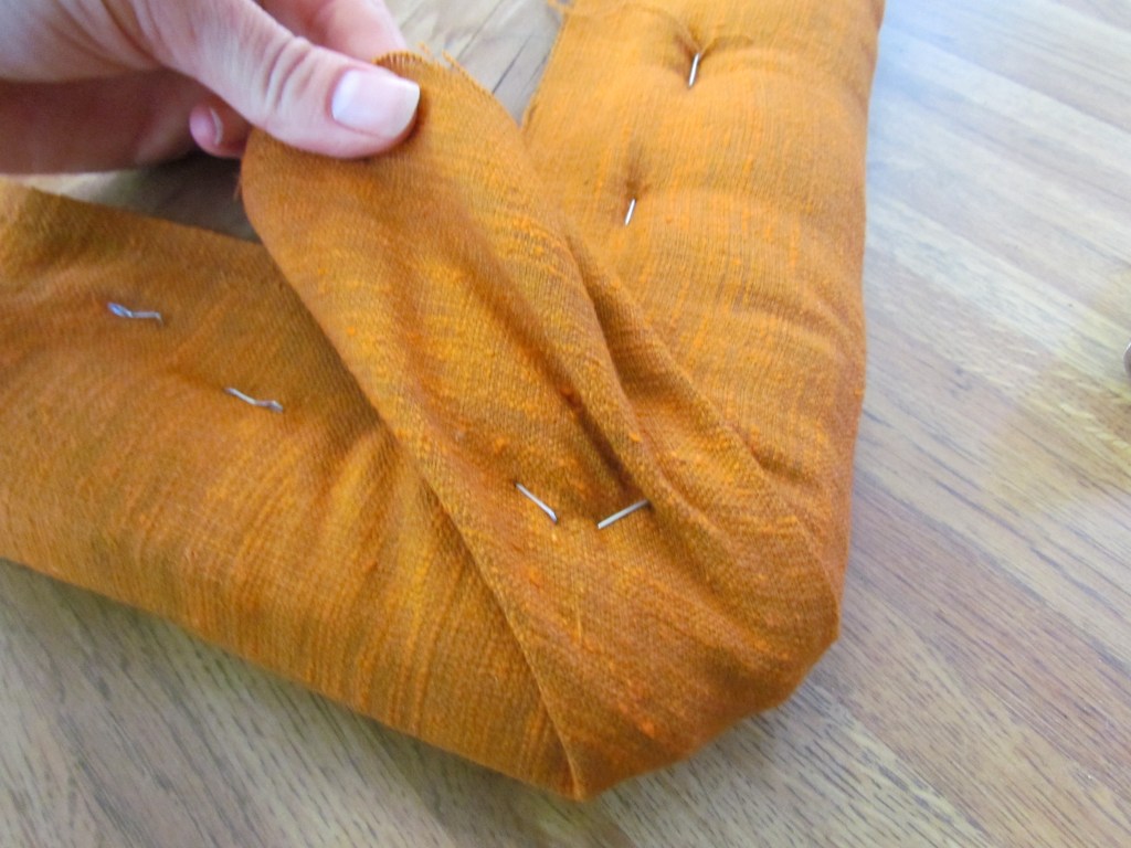 9. Create a "pleat" at the corners and check your pad side to make sure it's to your satisfaction. 